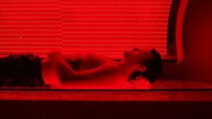 male patient in led light therapy