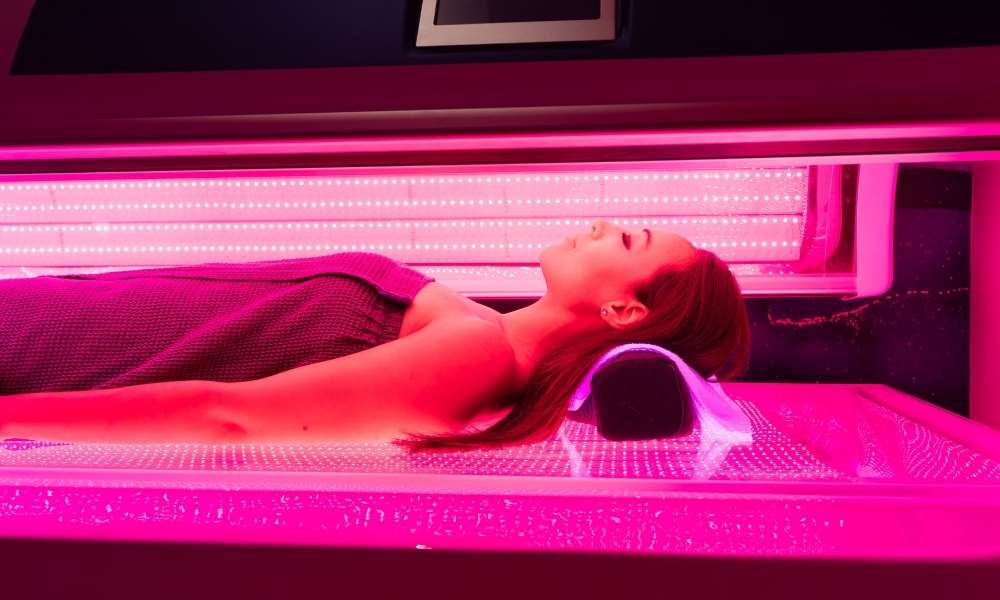 Woman receiving combined Red Light Therapy Benefits for acne at Sculptology San Ramon.