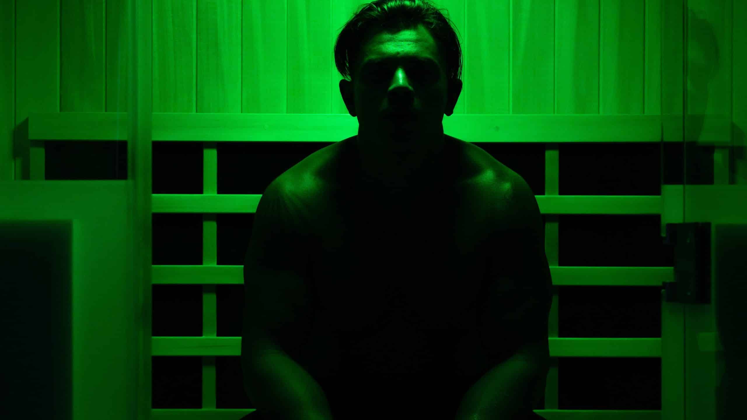 Man relaxing during infrared halo sauna session at Sculptology Wellness Center